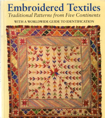 First  cover of 'EMBROIDERED TEXTILES. TRADITIONAL PATTERNS FROM FIVE CONTINENTS. WITH A WORLDWIDE GUIDE TO IDENTIFICATION.'